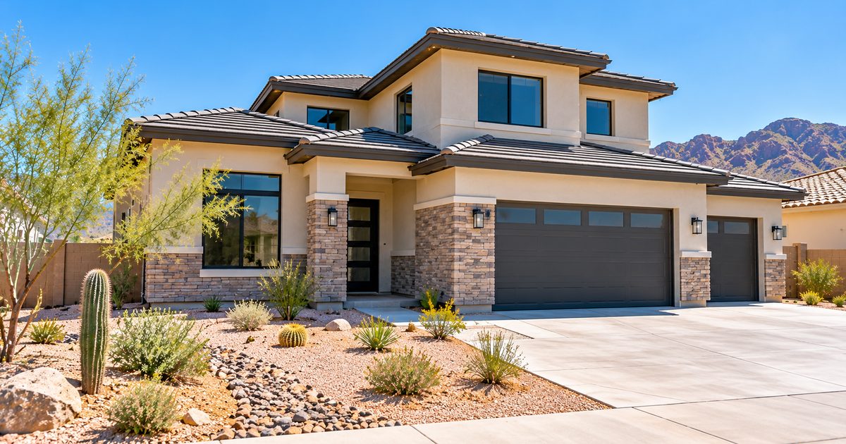 Newly built two-story home in a Gilbert, AZ desert neighborhood with fresh landscaping